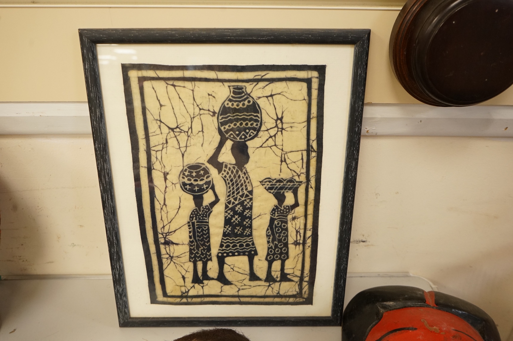 Four Japanese masks, two small oil lamps and a framed batik-16.5high x 19cm wide